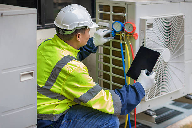 Professional Heat Pump Repair technician working in Siluria, AL